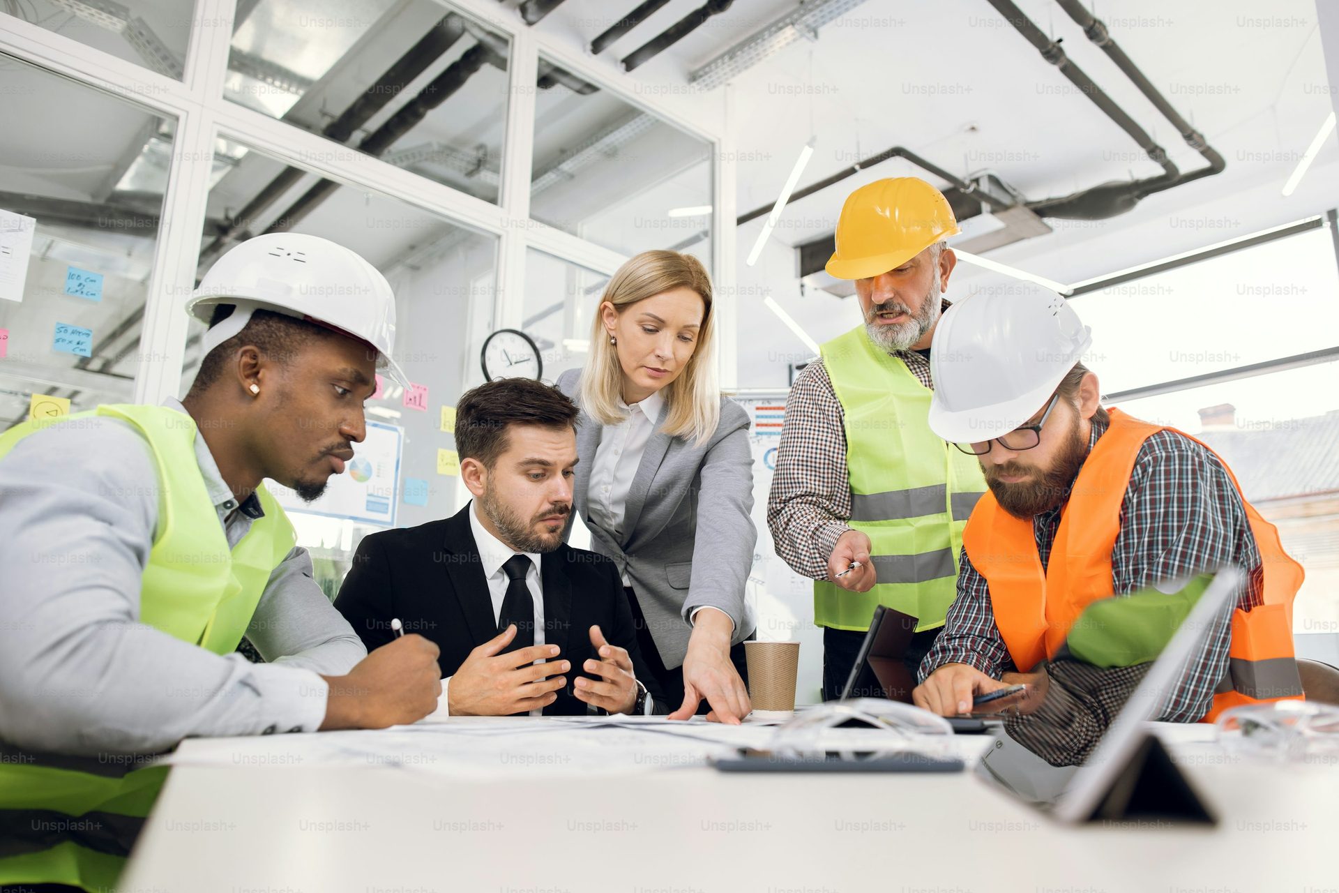 Professionals reviewing construction plans