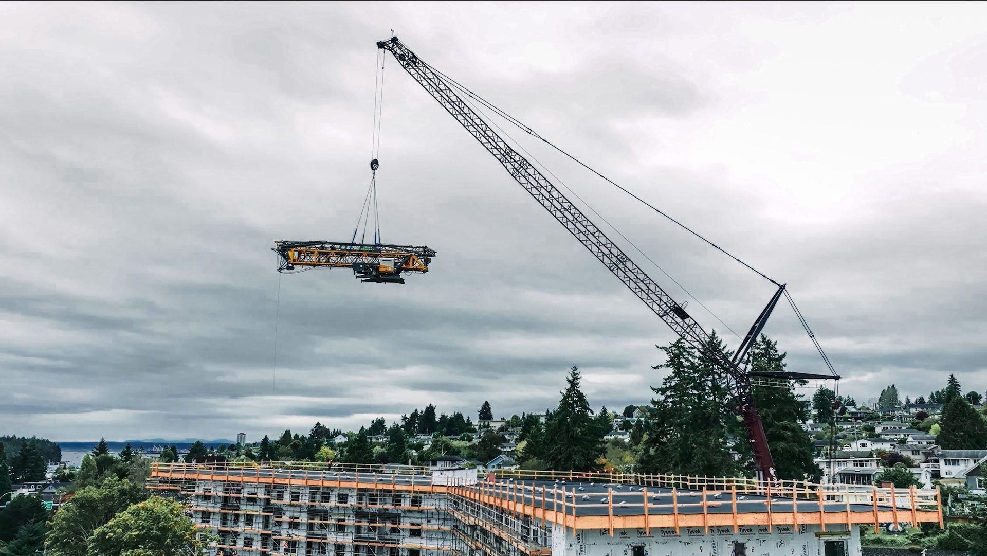 Active construction site with crane and modern building